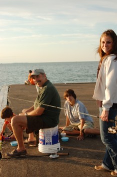 Jessie, her brothers and dad, fishing at family vacation spot, Lakeside, Ohio.